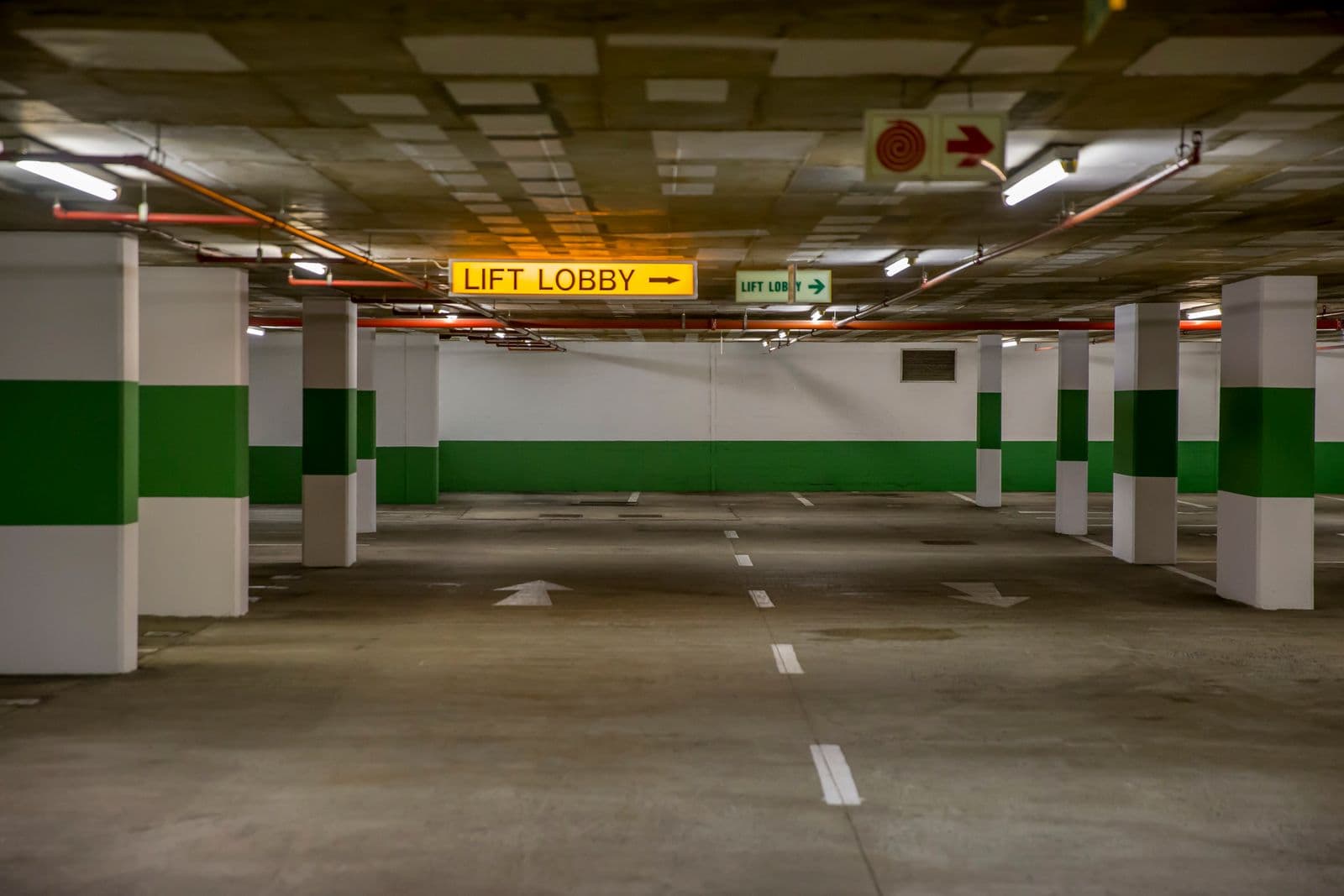 Underground parking garage with clear signage, patrolled by MLEO-certified officers